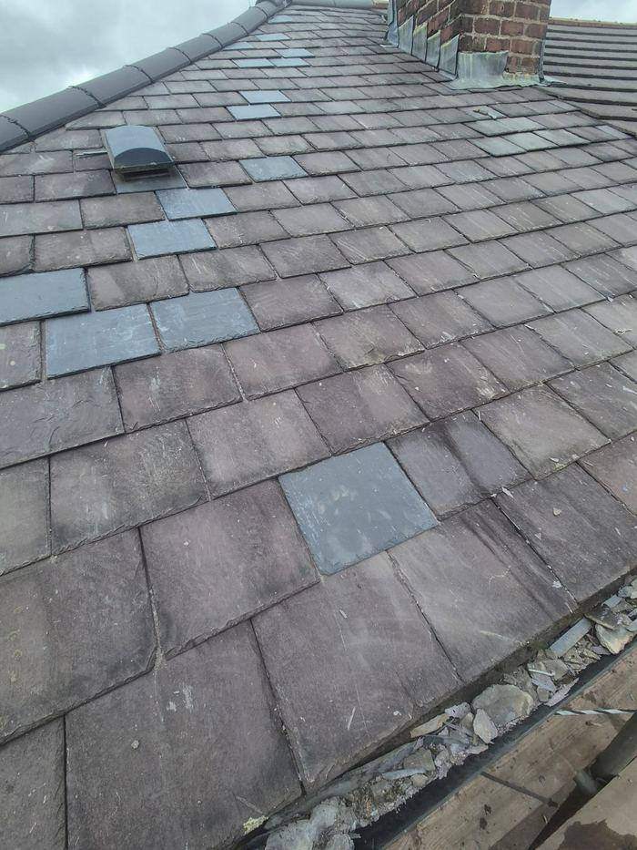 Roof hip with perished lead soakers and an open joint running the full length of the hip, letting water into the roof space