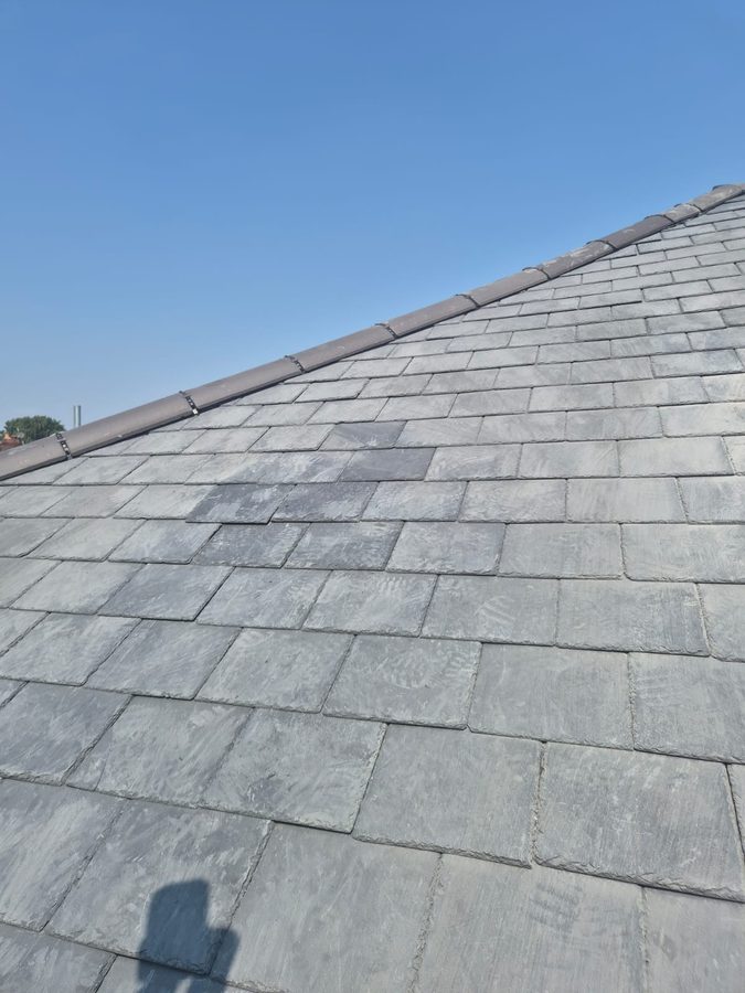 Slate roof slope viewed from the scaffold before any work starts