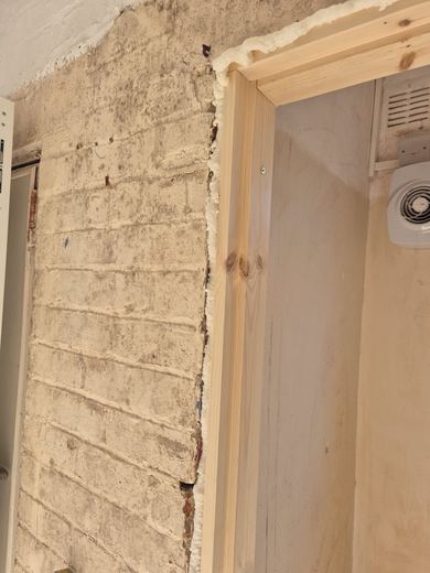 New lining and architrave scribed to an uneven wall