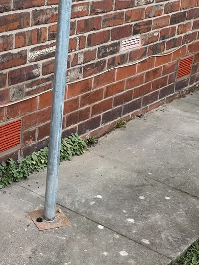 New terracotta airbrick bedded into the brickwork at low level