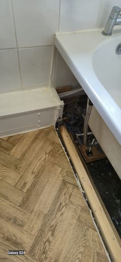 New bath edge sealed against the finished floor
