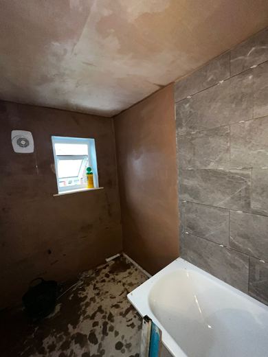 New bath fitted with the walls still to be made good