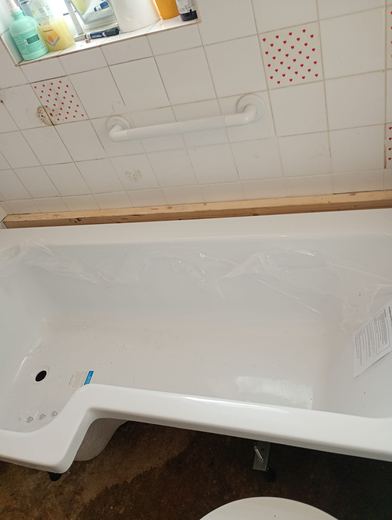 New bath set in place before tiling and boxing in