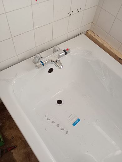 New bath with taps and waste fitted