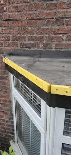Renewed bay window roof with new trim