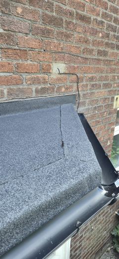 Renewed bay roof with the outlet and downpipe connected
