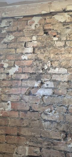 Original internal brickwork exposed after the plaster came off