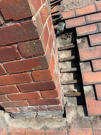 Chimney stack with the covering cut back around it