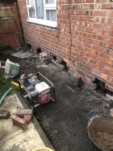 Cavity vents set into the brickwork at low level along the rear elevation
