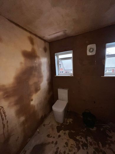 Bathroom stripped back and re-plastered where the wall had been wet