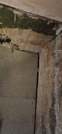 Doorway and wall stripped back ready for making good