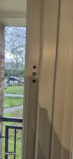 Communal entrance door onto a walkway