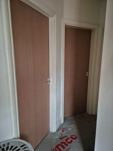 New fire doors hung off a hallway after renewal