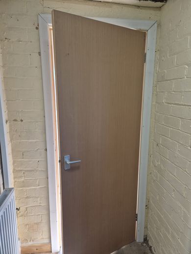 Fire door and new lining made good and ready for decoration