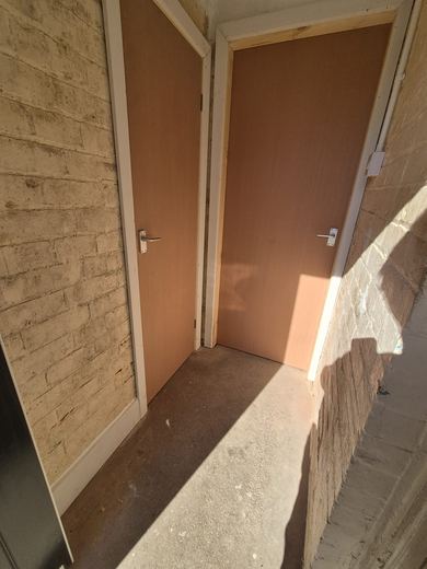 Two new fire doors hung off a communal landing