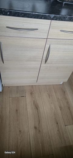Kitchen units and worktop fitted over new flooring