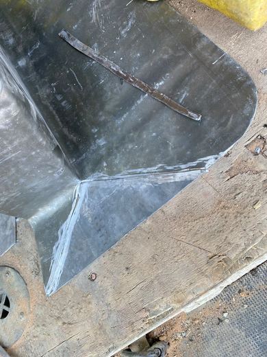 Sheet lead cut and formed over a board before it goes up to the roof