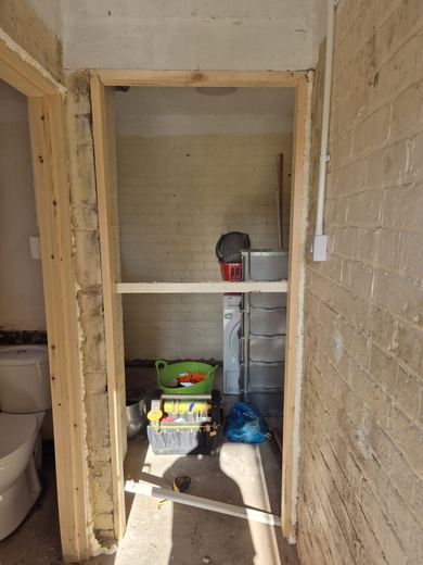 New door lining fitted into a stripped opening