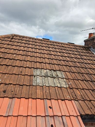 Completed outrigger roof, newly tiled and sitting against the original roof covering