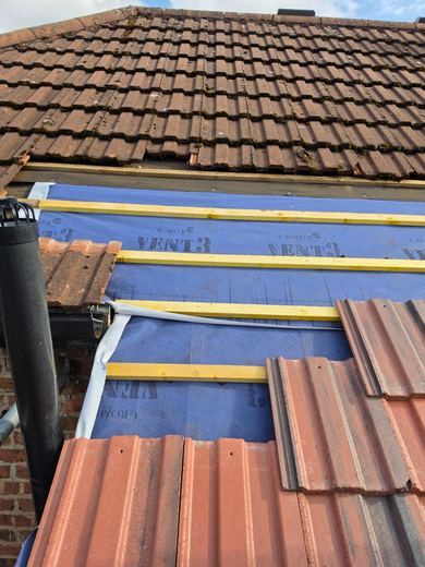 New breathable underlay and treated battens laid across the outrigger roof ready for tiling