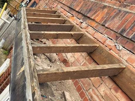 Roof opened up to expose the timbers, with new treated joists set in place over the brickwork
