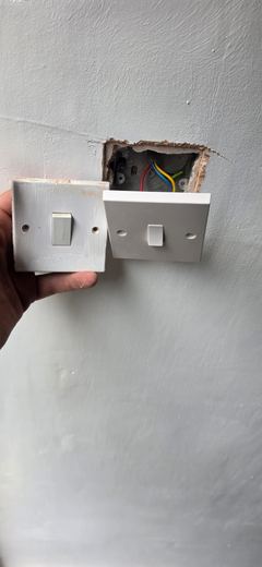 Socket being offered back to the wall after wiring