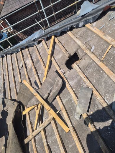 Roof stripped back to the rafters with old battens cleared