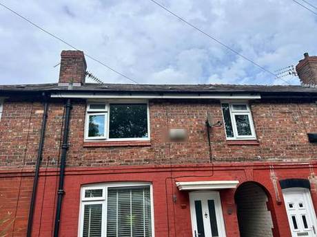 Painted brick terrace elevation with the roofline, eaves and rainwater goods completed